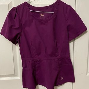 Jaanuu scrubs set. One peplum top and one bottom flared bottom.
